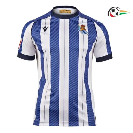 Real Sociedad Equipacione Futebol Local 2025/26 com Patch da La Liga Azul/Branco Real Sociedad Equipacione Futebol Local 2025/26 com Patch da La Liga Azul/Branco