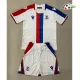 Camisa Reserva Infantil Crystal Palace FC 2025/2026 Branco/Azul/Vermelho